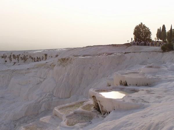Pamukkale:  the white plateaus are formed by the travertine deposits of calcium oxide