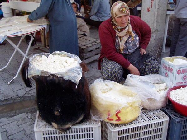 Korkuteli (region of nomadic living) market day:  cheese in a goat skin