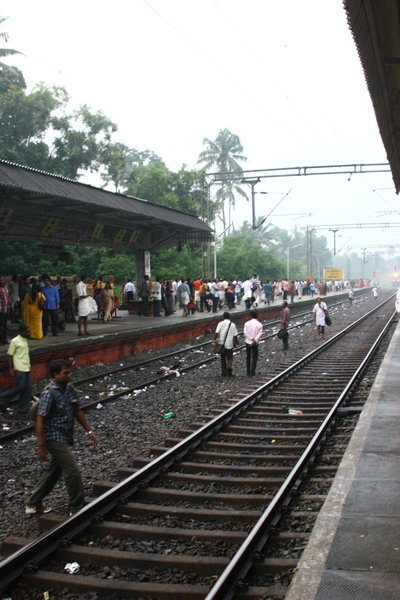 Train from Cherthala to Trivandrum, notice passengers lining up in the tracks!