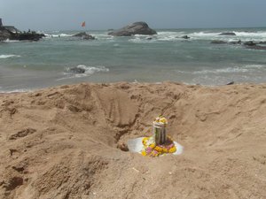 Shiva Lingam dug into the sand