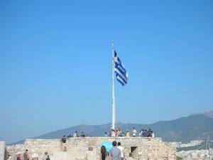 Greek flag behind the Parthenon