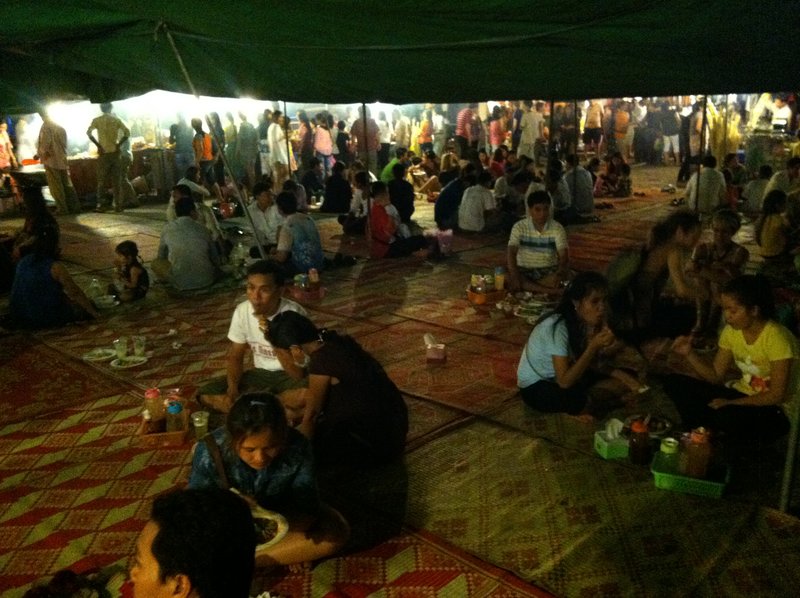 At the night market everyone sat on the ground to eat
