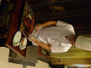 The chef cutting our roasted duck for lunch