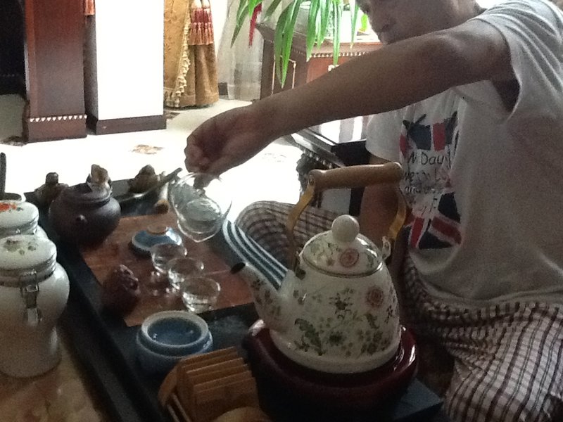 Showing me how to serve traditional tea