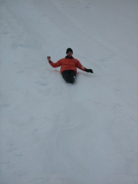 Barry sliding in the snow at Almirante Brown