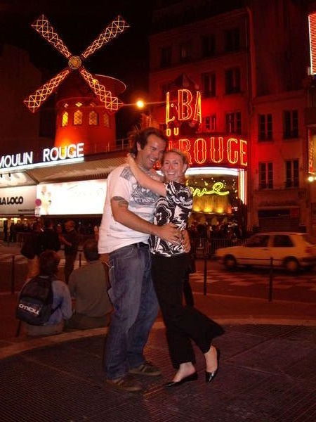Getting blown away outside the Moulin Rouge