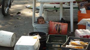Baby in a bucket. Guatemala.