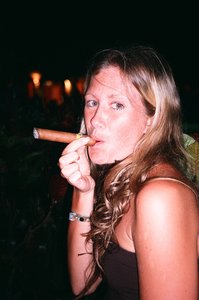 Nikki smoking a cohiba