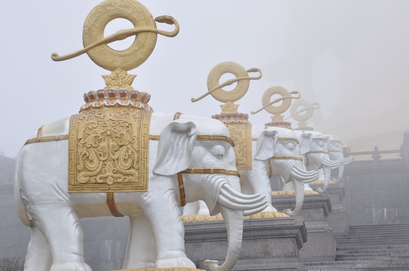 Elephants lining the steps to the Buddhist Temple