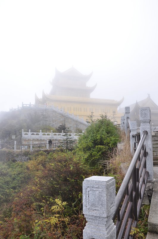 Steps leading to a misty Buddhist Temple