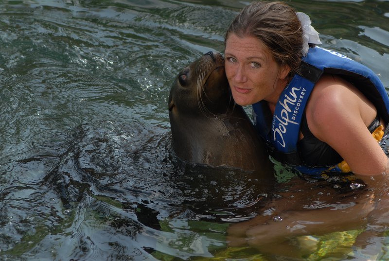 Nikki having a kiss from a sea lion