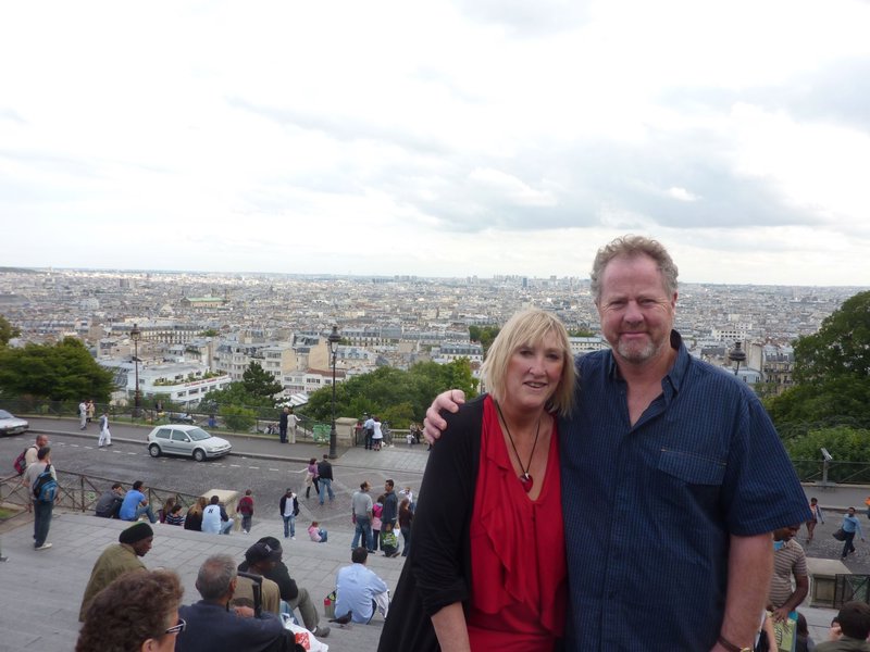 In front of Sacre Coeur with a view of Paris