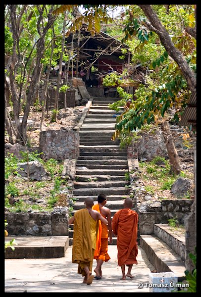 monks in the temple on a hill