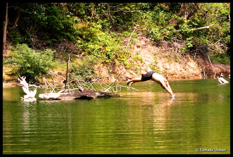Tomek jumping into water