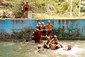 novice monks playing in a pool