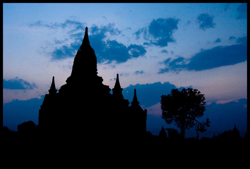 silhouette of Htilominlo Temple at sunset
