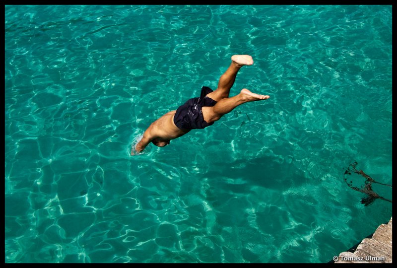 Tomek jumping into the crystal clear water