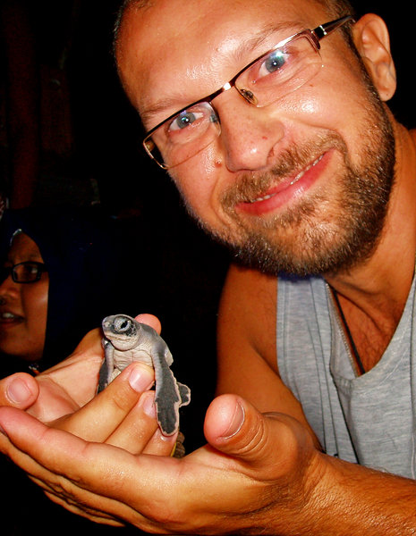 Tomek and baby turtle