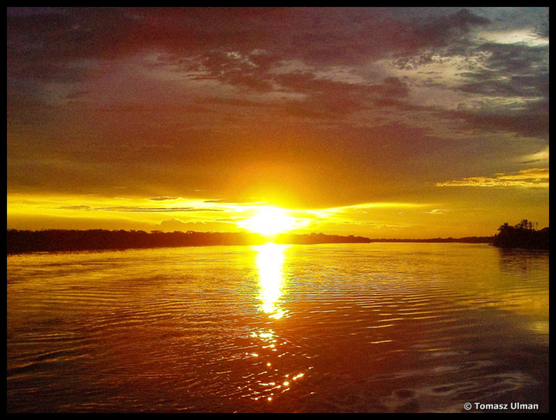 sun setting over the Amazon