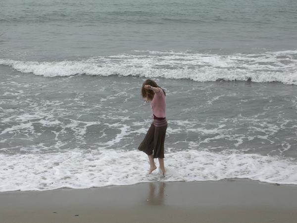Izzie running through the sea