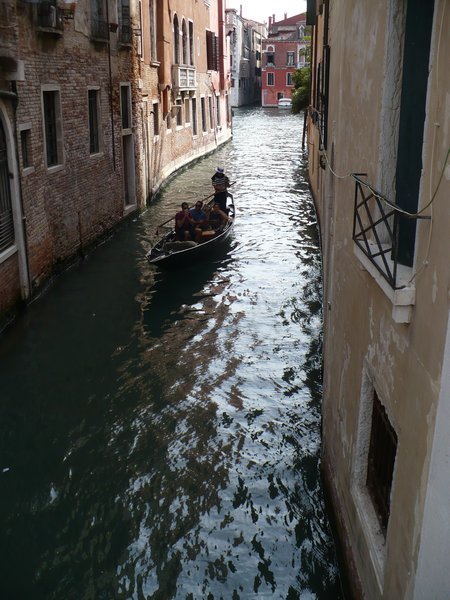A classic gondola in a small canal