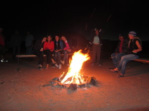 Huddling round the camp fire to keep warm - it got pretty chilly at night!