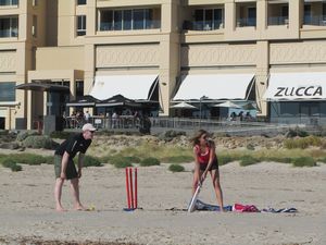 Enjoying a game of beach cricket...