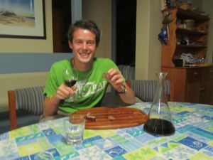 Ben very much enjoying the sausage tasting and the red wine!