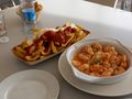 Our dinner of Patatas Bravas and Gambas (shrimp)