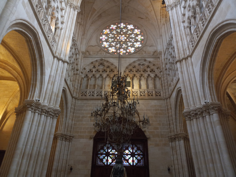 A chandelier and window of the cathedral