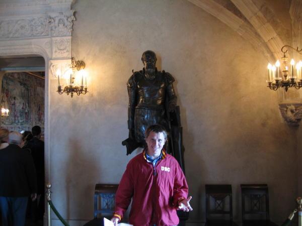 Aaron in front of a statue