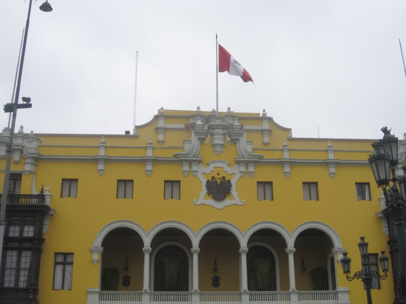 Peru flag on yellow building