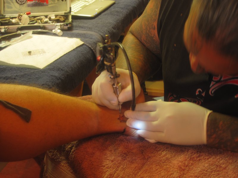 Scott getting his first tattoo