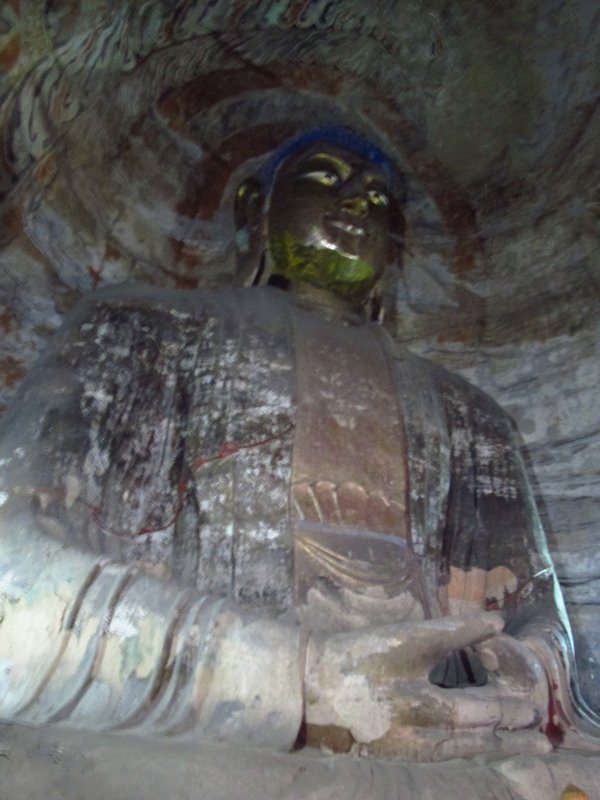 Giant gold Buddha inside cave