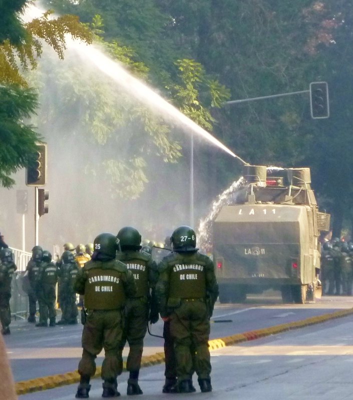spittling "guanacos:" tanks that spray water and tear gas