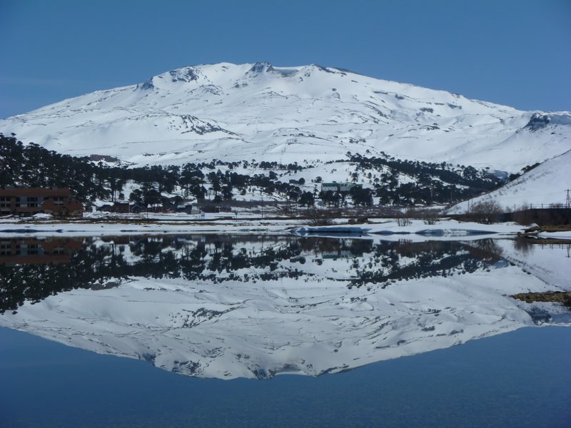 Caviahue below its volcano; reflections like this were generally available only in winter when the infamous Patagonian winds subsided