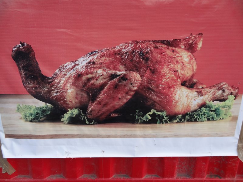 a roast chicken doing push-ups