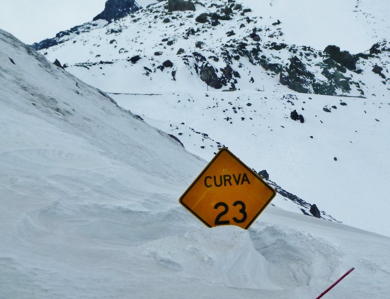 curve 23 sign almost buried by snow