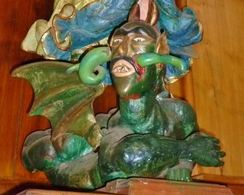 Satan--fab, hand-carved folk art in churches
