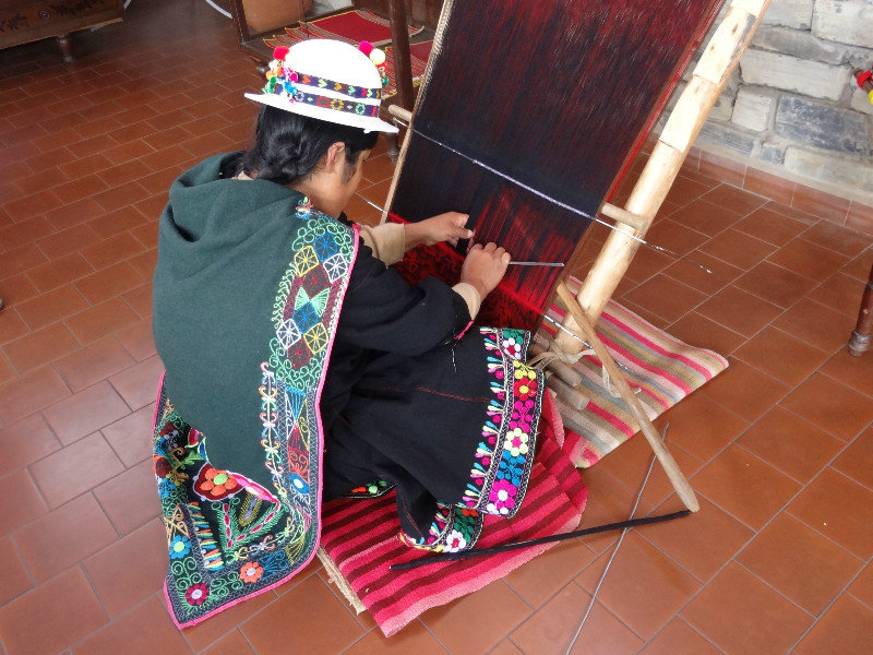 indigenous weaver in a museum