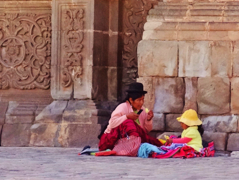 Textile seller in front of Puno cathedral