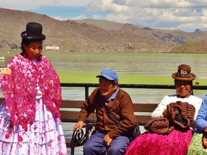 Dancer and admirers at Lake Titicaca