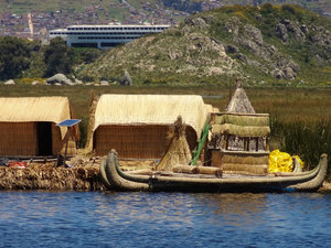 Uros Island with solar panal backed by reeds and private island 