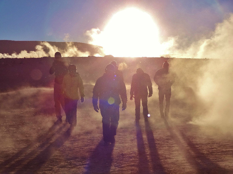 aliens in the hellish geyser field at sunrise