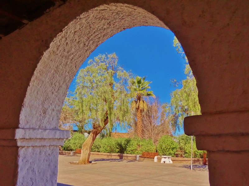San Pedro plaza through arches