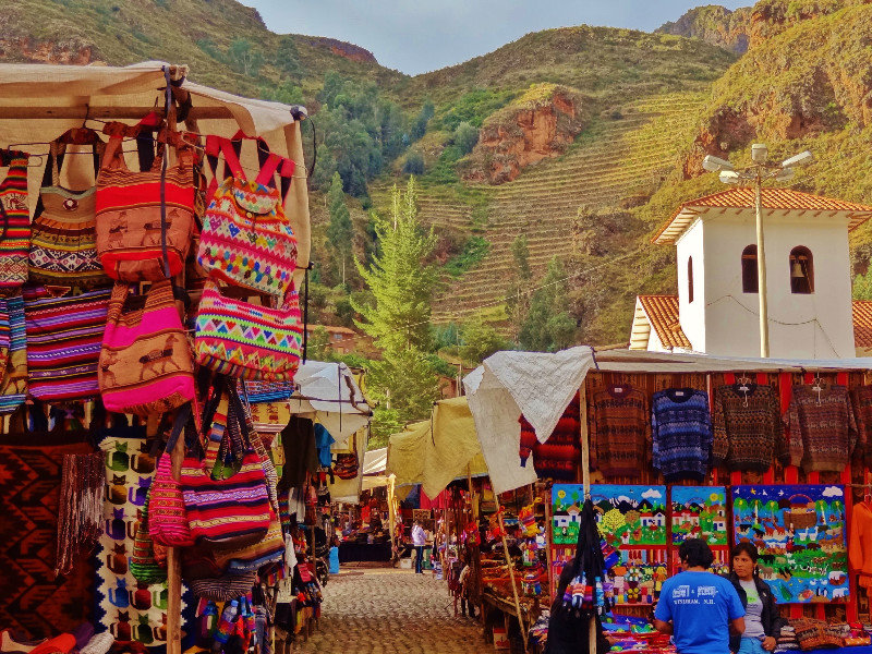 Pisac market and Incan terraces climbing the mountain