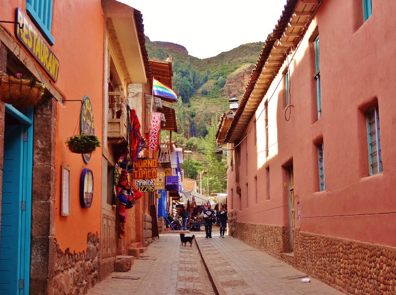 colorful tourist street with surrounding mountains