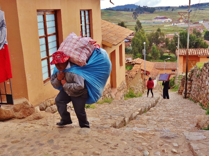 heavy loads up Chinchero's steep streets