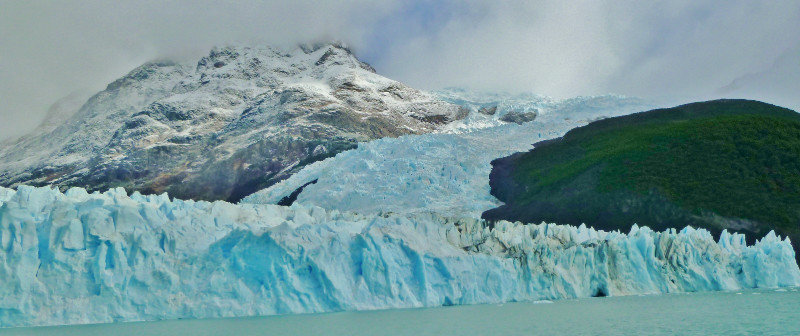 glacier flowing from mountains