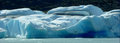 wall of ice bergs block entrance to a fiord